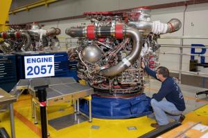 An Aerojet Rocketdyne engineer at its facility located at NASA’s Stennis Space Center examines RS-25 engine, 2057, which is slated for the Artemis III, the third flight of NASA’s Space Launch System.