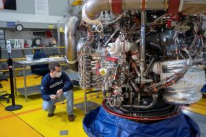 An Aerojet Rocketdyne engineer at its facility located at NASA’s Stennis Space Center examines RS-25 engine, 2057, which is slated for the Artemis III, the third flight of NASA’s Space Launch System.