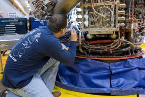 An Aerojet Rocketdyne engineer at its facility located at NASA’s Stennis Space Center examines RS-25 engine, 2057, which is slated for the Artemis III, the third flight of NASA’s Space Launch System.